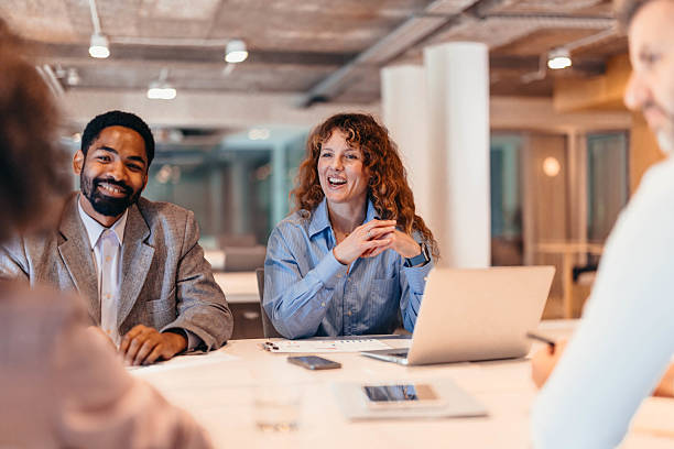 istock Business team enjoying a productive meeting in modern office 2212460707