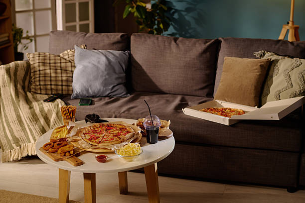 Cozy Living Room Evening with Pizza and Snacks