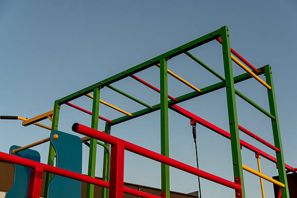 istock Brightly colored climbing frame in a playground invites children to play and explore in the warm light of late afternoon 2212462269