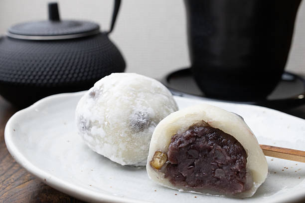 istock Mame Daifuku cut in half on a white plate 2212471657