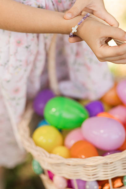 A Child Holding a Vintage Egg Basket Filled with Colorful Plastic Eggs, Enjoying an Easter Egg Hunt on a Dreamy Spring Morning to Celebrate the Easter Holiday.