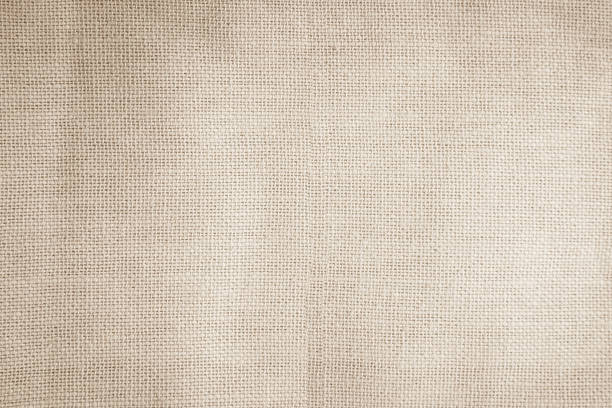 istock Brown sackcloth woven texture background in natural pattern. Jute hessian burlap, linen background in light beige cream color blank. Weaving canvas fiber line cotton cloth textured as organic. 2212474068