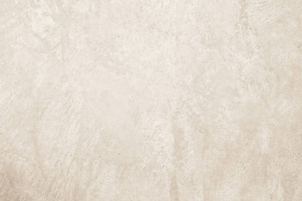 istock Colour old concrete wall texture background. Close up retro plain cream color cement wall background texture. Design paper vintage parchment element. 2212474078