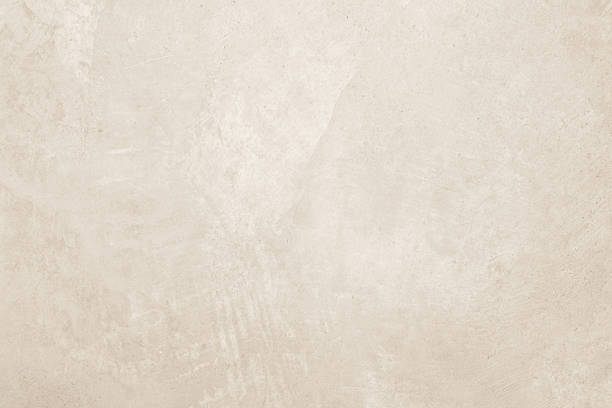 istock Colour old concrete wall texture background. Close up retro plain cream color cement wall background texture. Design paper vintage parchment element. 2212474102