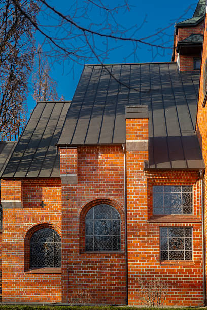 istock brick facade of an old church in sunlight 2212474886