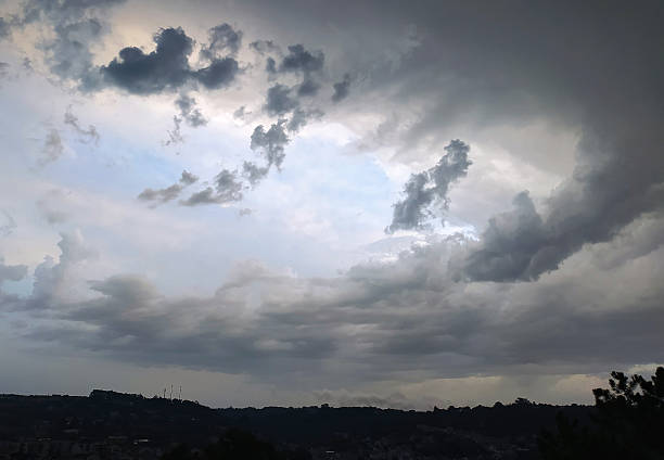 istock Dramatic skyscape featuring a stormy sky filled with dark, ominous clouds over a blurred landscape. Evokes feeling of change, weather, or foreboding. Use for backgrounds, nature, environment. 2212475105