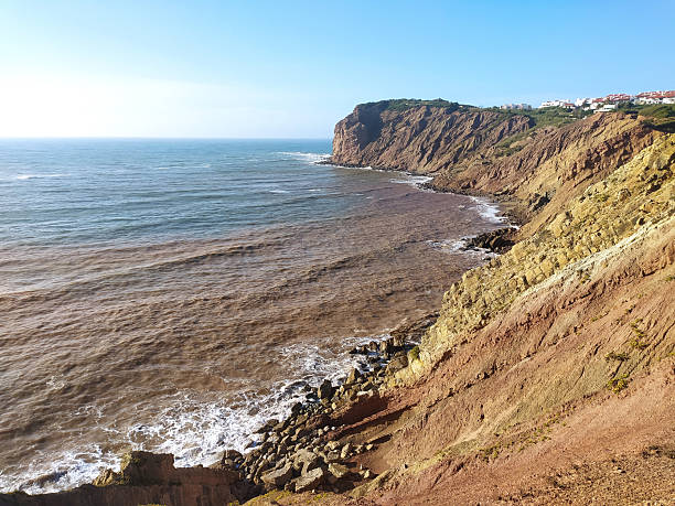 istock Dramatic coastal landscape featuring rugged cliffs overlooking a vibrant ocean. Ideal for travel, environmental, or naturethemed projects and conveys a sense of exploration. 2212475112
