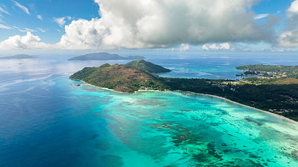 istock Expansive coastline with vibrant reefs and blue ocean. Praslin, Seychelles. 2212478900