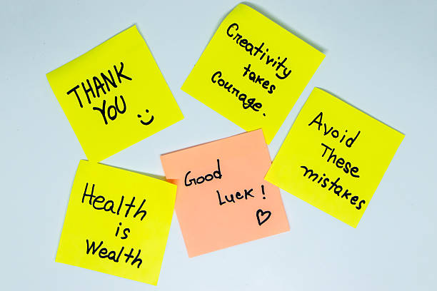 istock Positive affirmations concept. Phrases of different colors sheets for notes on a green background. Motivational concept with handwritten text. 2212486665