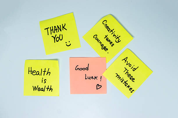 istock Positive affirmations concept. Phrases of different colors sheets for notes on a green background. Motivational concept with handwritten text. 2212486704