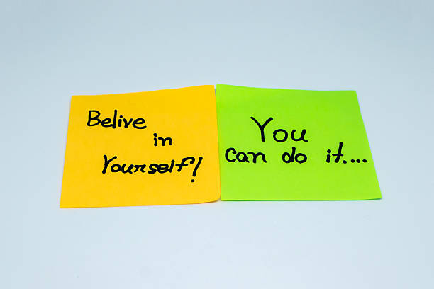 istock Positive affirmations concept. motivation words on sticky note with isolated background 2212487036