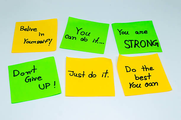 istock Positive affirmations concept. motivation words on sticky note with isolated background 2212487073