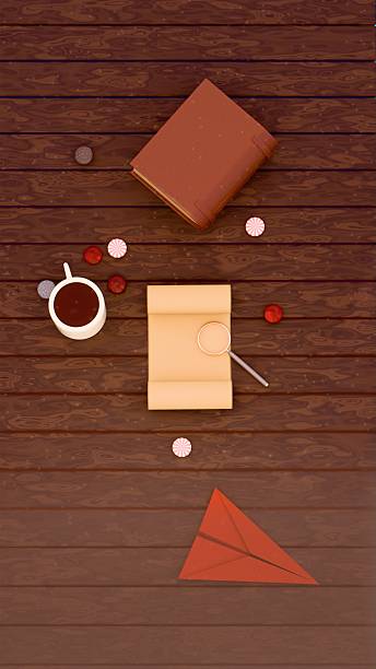 istock Overhead view of vintage objects on wooden table including coffee mug, rolled parchment with magnifying glass, closed book, candies, and paper airplane. Travel, discovery, nostalgia theme 2212487800