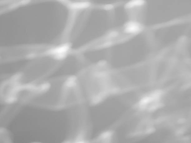 istock Light reflects on the water surface on the wall and blurs. 2212489196