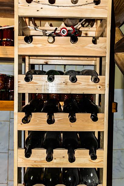 istock Cellar with wooden shelves for wine bottles. 2212490980