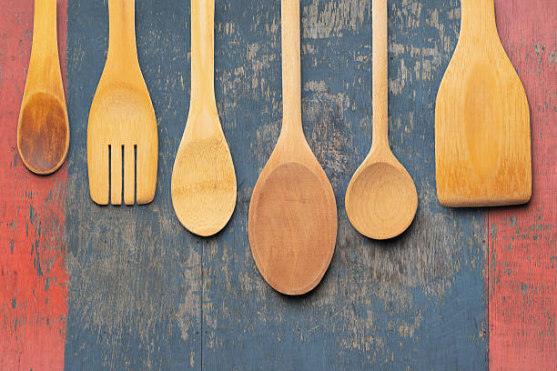 istock Assorted Wooden Kitchen Utensils on a Rustic Painted Wooden Background. File with Clipping Path. 2212491168