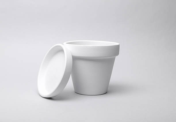 istock White empty clay flowerpot on gray background. Mockup for design 2212497550