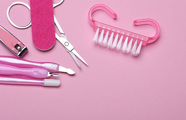 istock Nail care tools, manicure set on pink background. Flat lay. Top view 2212498341