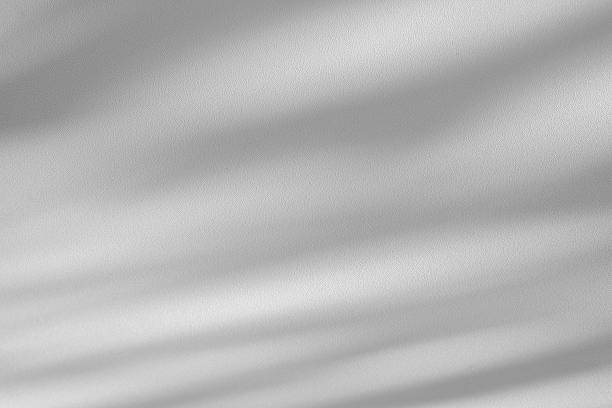 istock Wall interior background, studio and backdrops show products.with shadow from window color white . background for text insertion and presentation product 2212499447
