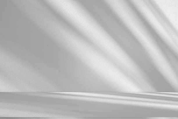istock Wall interior background, studio and backdrops show products.with shadow from window color white . background for text insertion and presentation product 2212499453