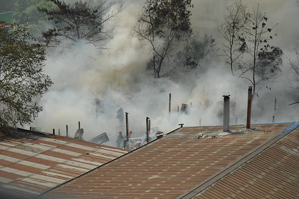 istock fire smoke in a city, fire and smoke from a building 2212500838