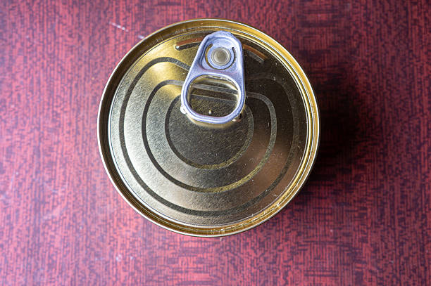 istock Round tin can with food on surface 2212501998