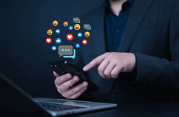 istock Social media and digital online, man using smart phone use social media network application, Friend reply chat concept or send emoticon for react feeling, playing Social media Distancing. 2212502002
