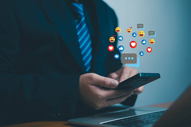istock Social media and digital online, man using smart phone use social media network application, Friend reply chat concept or send emoticon for react feeling, playing Social media Distancing. 2212502004