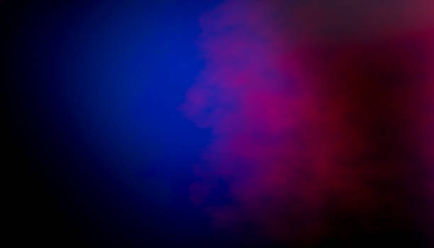 istock Blue and purple smoke creating a colorful abstract background 2212506371