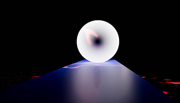 istock Hand Reaching for a Bright Orb of Light in a Dark Space 2212506382