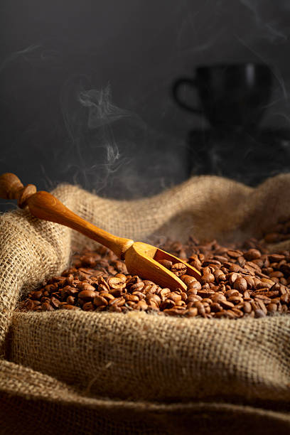 istock Fresh roasted coffee beans in burlap bag. 2212507394
