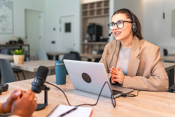 istock Podcasters recording audio content in a professional studio 2212513657