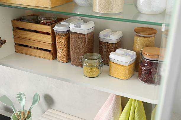 istock Different types of cereals and legumes in containers in kitchen 2212513693