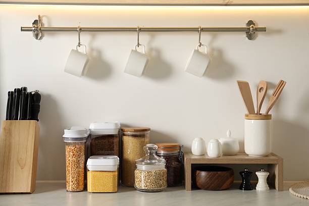 istock Different types of cereals and legumes in containers on light marble table in kitchen 2212513700