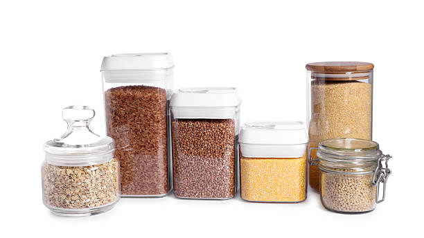 istock Different types of cereals in containers isolated on white 2212513778
