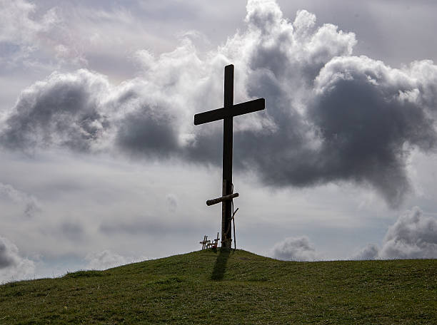 istock A solitary large cross on a hilltop against a dramatic cloudy sky creates a serene and contemplative scene 2212515717