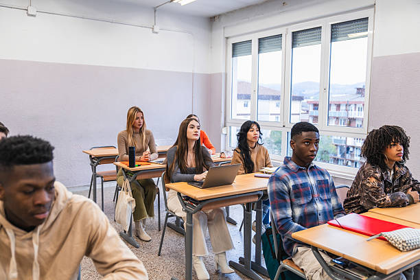 istock High school students listening attentively in class 2212518957