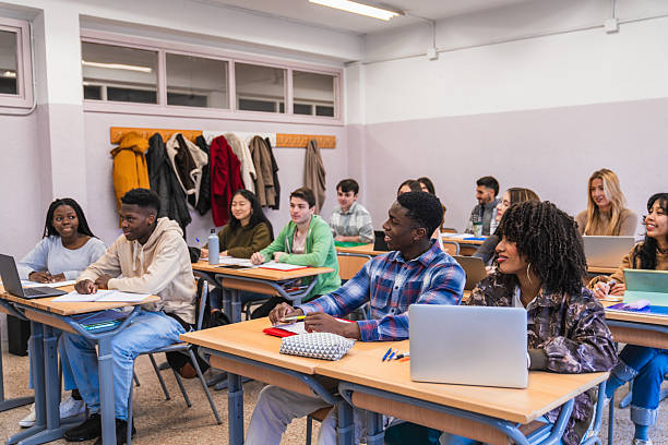 istock High school students listening attentively in class 2212519863
