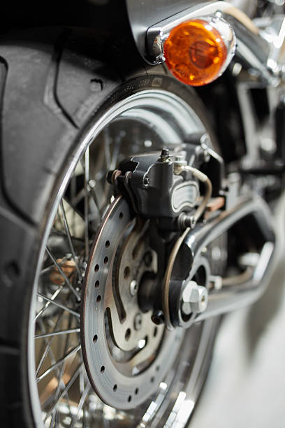 istock Close-up View of a Motorcycle's Front Wheel Assembly Including Brake Disc 2212520874