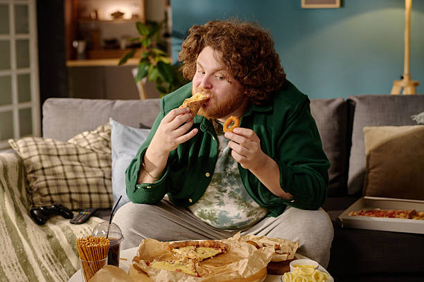 istock Enjoying Evening Snack and Video Games at Home 2212521197
