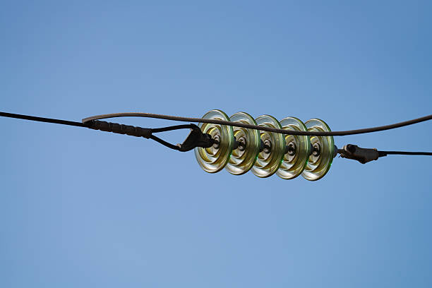 wires on a high-voltage power line next to the railway, spring day