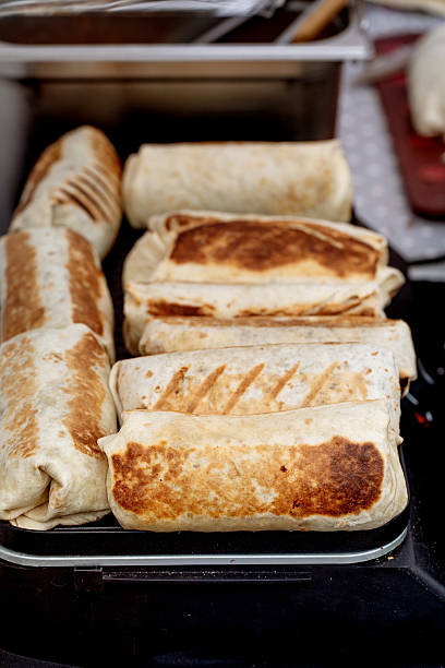 istock Grilled Burritos on Cooking Surface 2212524044