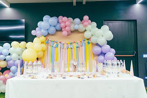istock Colorful Balloon Arch with Party Table Setup 2212524050