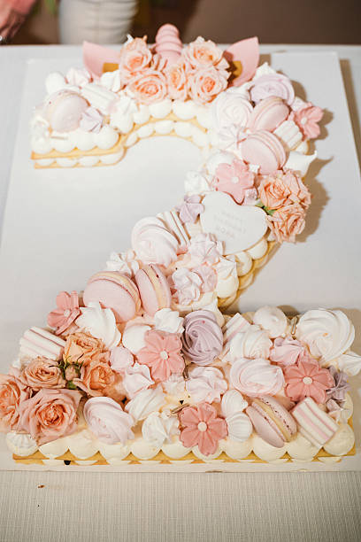 istock Number 2 Cake Decorated with Macarons and Flowers 2212524060