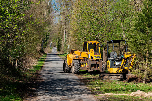istock Heavy machinery working on a rural road in springtime 2212525300