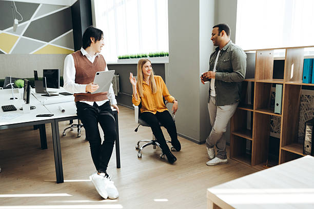 istock Multicultural colleagues having informal meeting in modern office 2212526911