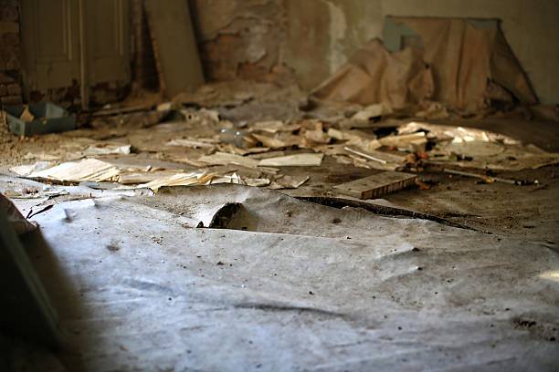 A view from stairs showing a room in Cape Town, highlighting poverty.