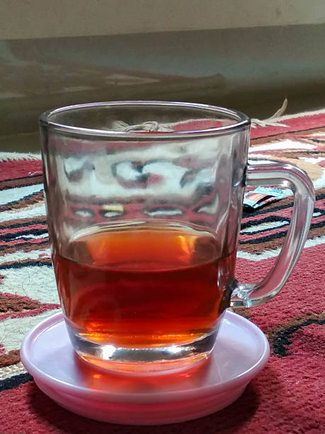 istock A clear glass mug with a handle contains a reddish-brown tea 2212530253