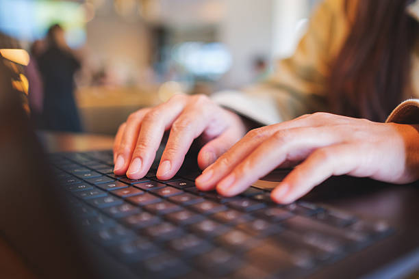 istock Closeup image of a woman hands working and typing on laptop computer keyboard 2212530773