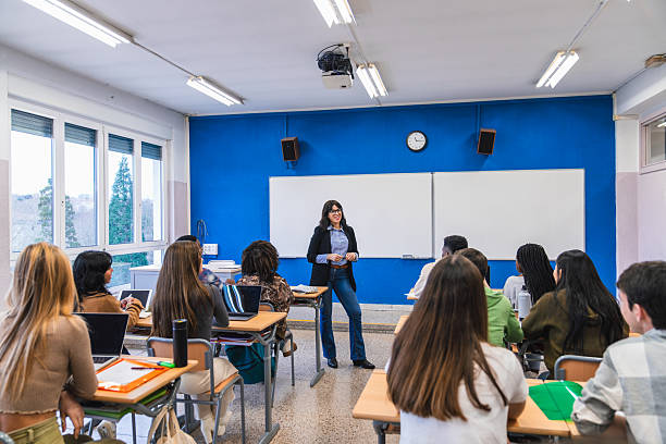 istock High school teacher giving lesson to students in classroom 2212530857